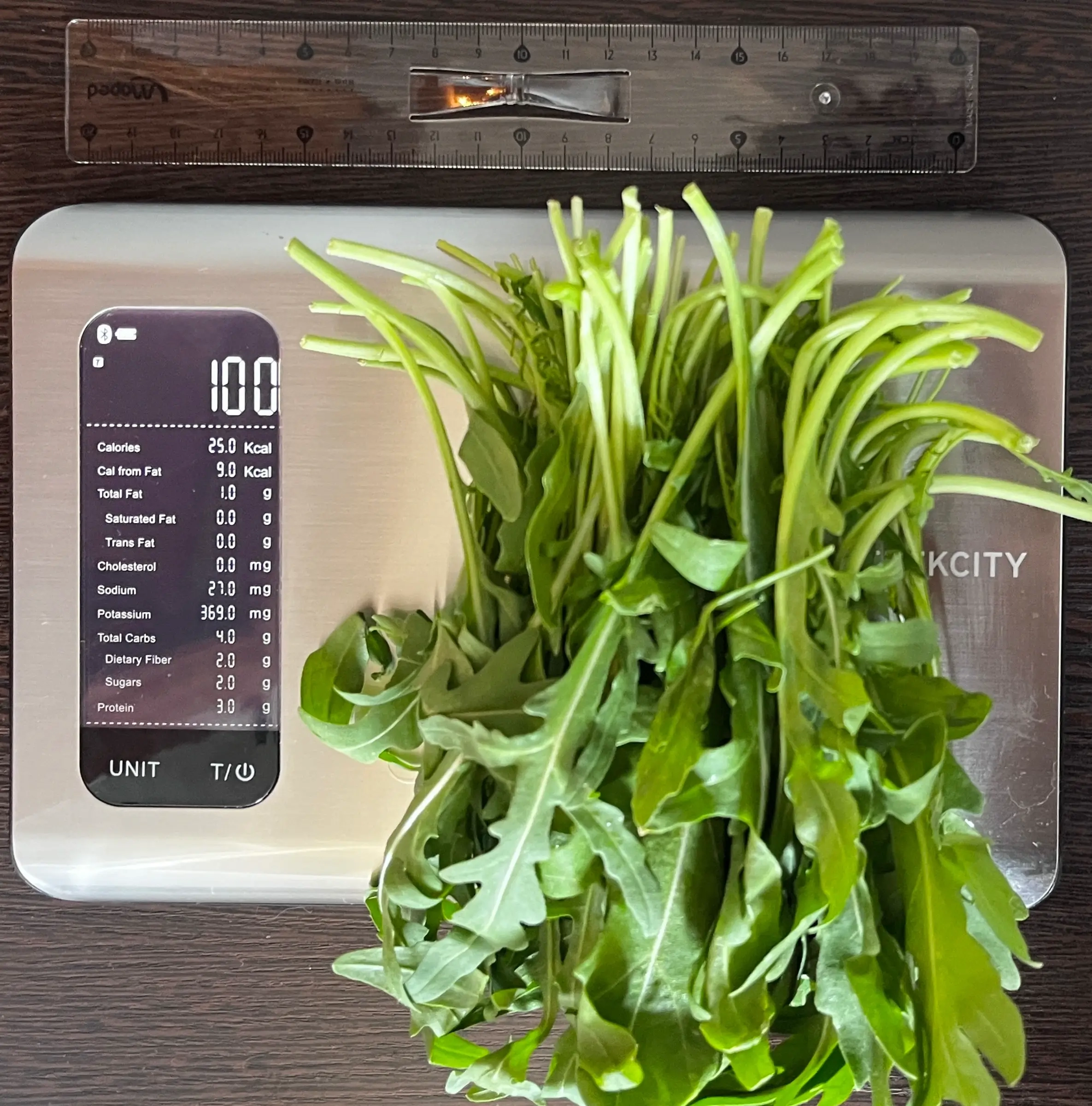 25 Calories or 100 Grams of Arugula on scale