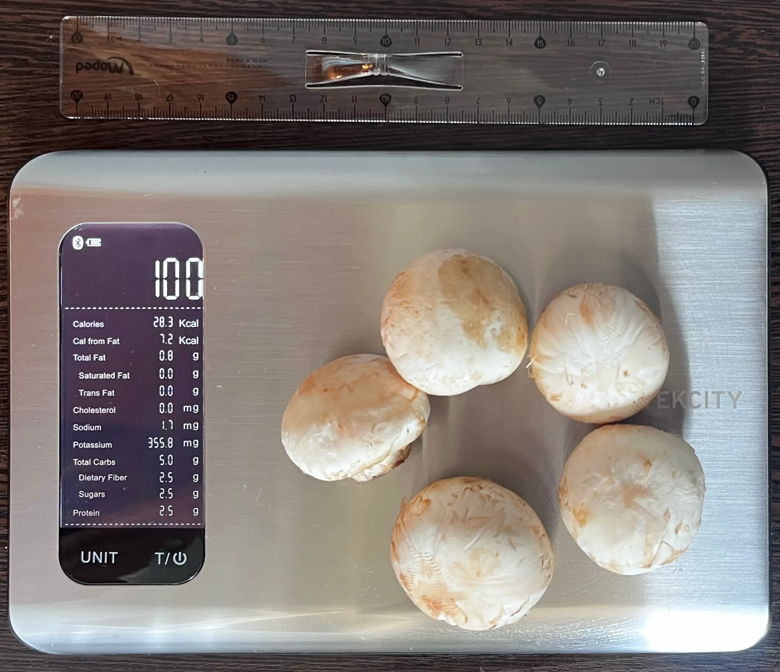 22 Calories or 100 Grams of Mushrooms on scale