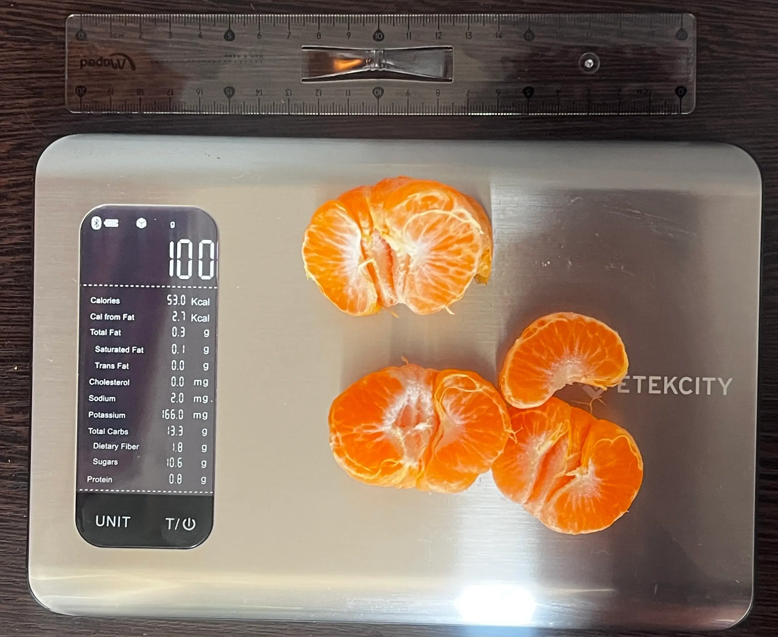 53 Calories or 100 Grams of Mandarin Oranges on scale