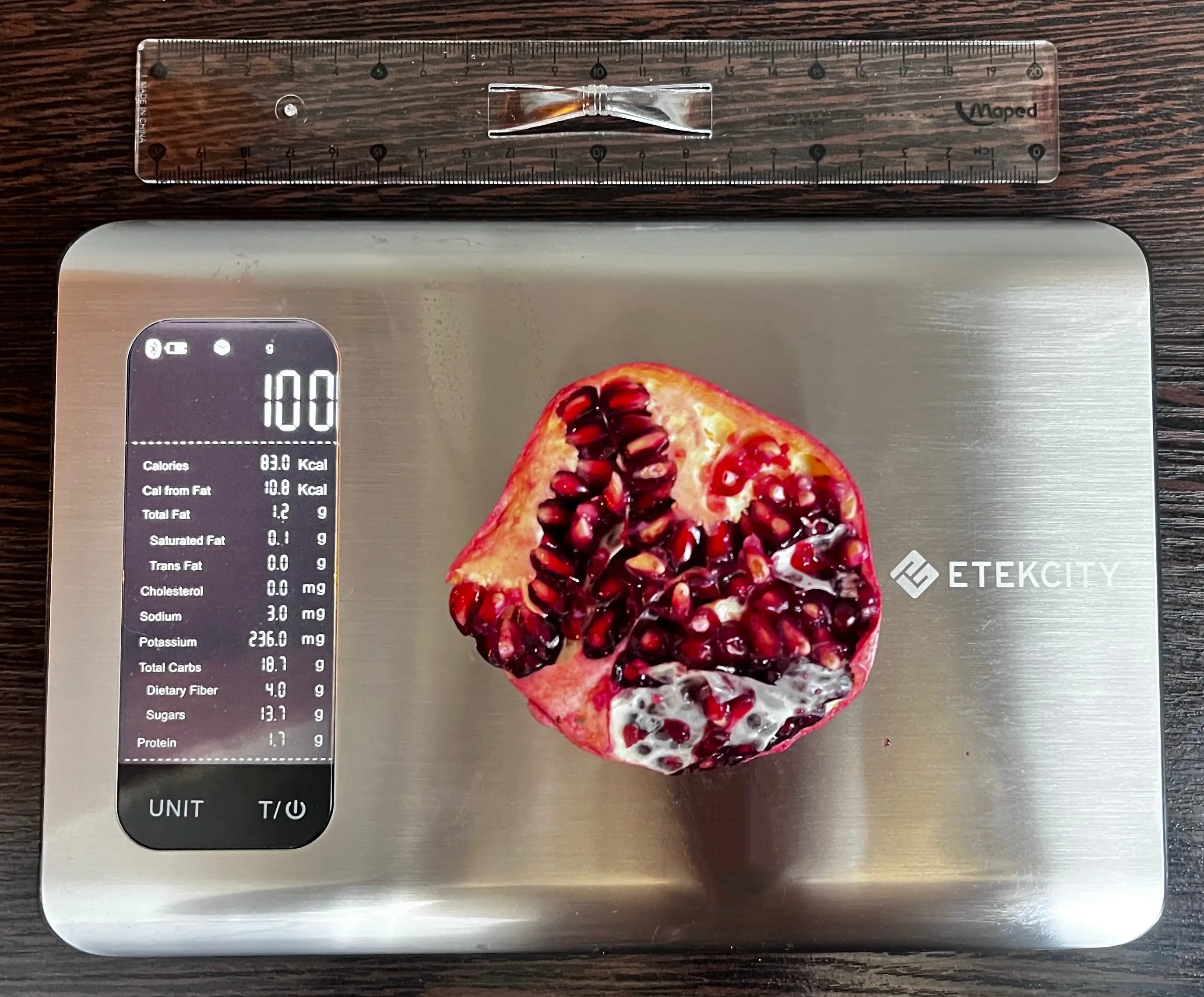 84 Calories or 100 Grams of Pomegranate on scale